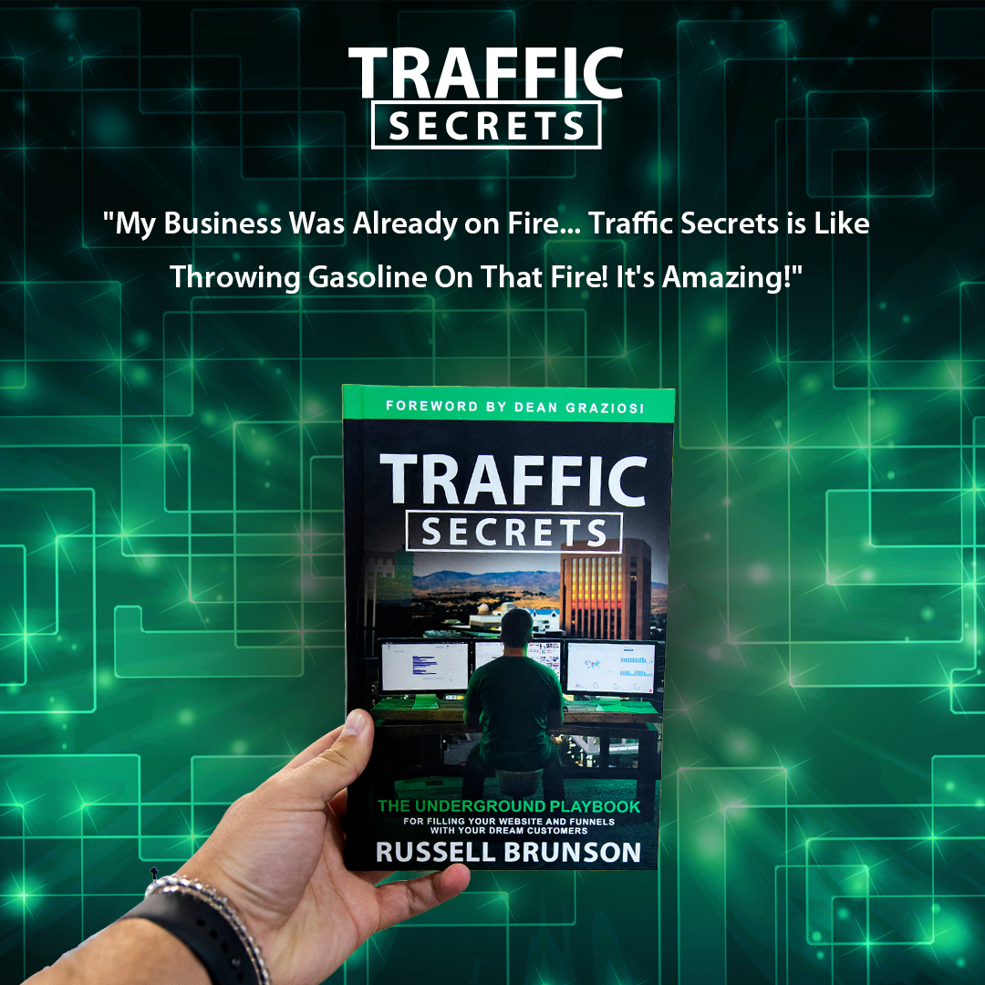 A hand holding up the Traffic Secrets book with a technical background