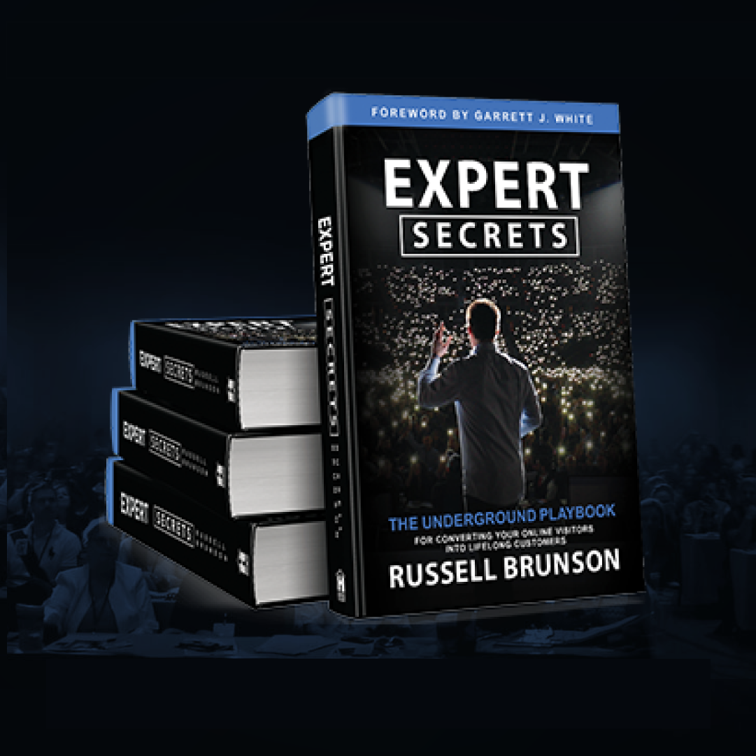 Expert Secrets Book leaning against a stack of Expert Secrets Books